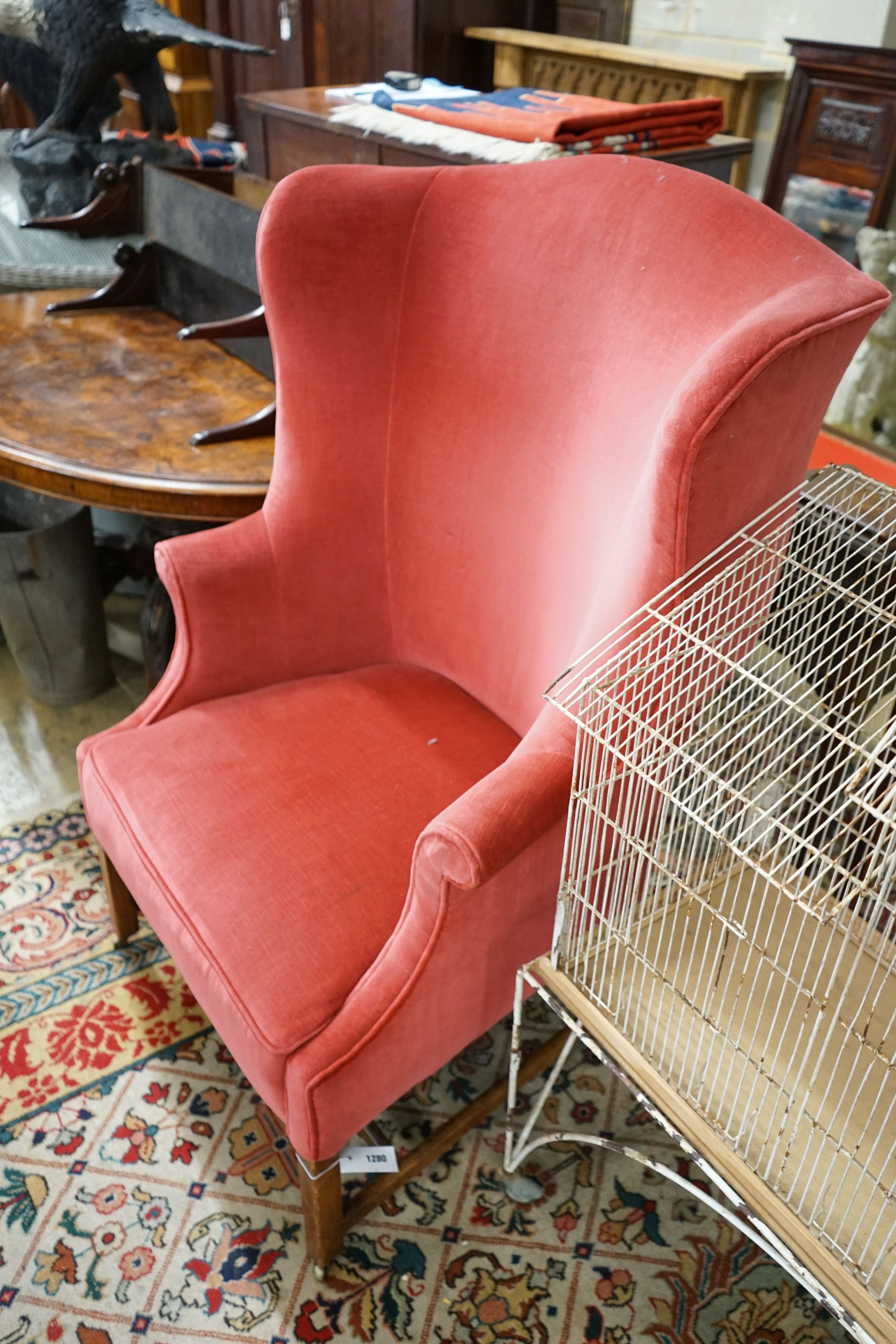 A George III provincial upholstered tub shaped armchair, width 76cm, depth 58cm, height 120cm